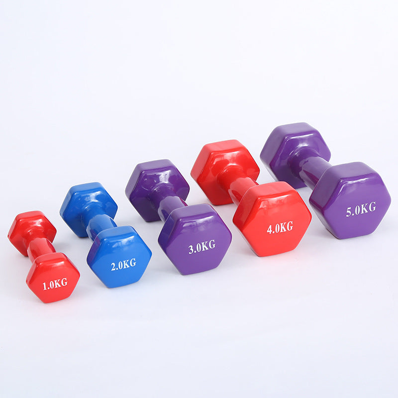 Color fitness dumbbells. Haltères de fitness colorés.